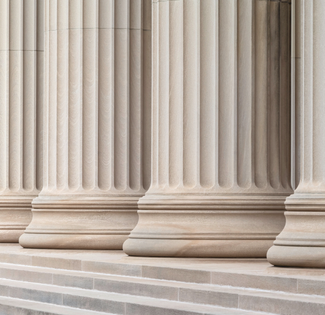 Classical stone pillars, symbolizing institutional strength