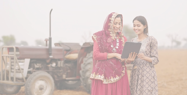 Women reviewing farming data on a tablet in a field